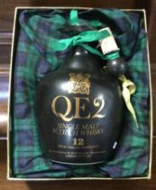 A boxed QE2 commemorative 26 2/3 fl ozs bottle of