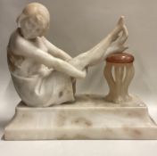 A good marble figure of a lady in seated position on sweeping base.