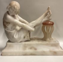 A good marble figure of a lady in seated position on sweeping base.