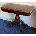 An attractive rosewood hinged top card table on four sweeping supports.