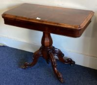 An attractive rosewood hinged top card table on four sweeping supports.