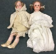 Two old German porcelain headed dolls.