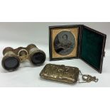 A small cased compact together with opera glasses etc.