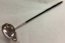 A rare 18th Century Georgian silver and whalebone toddy ladle.