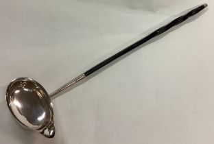 A rare 18th Century Georgian silver and whalebone toddy ladle.