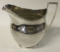 A George III silver bright-cut jug.