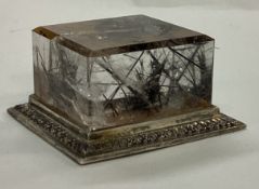 A novelty silver and glass cube.