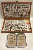 A boxed collection of fishing flies.
