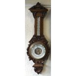 A good carved oak barometer.