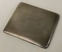 An engine turned Alfred Dunhill silver cigarette case.