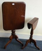 A good Victorian mahogany tilt top table together with one other.