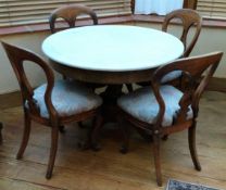 A good marble top pedestal table together with four matching chairs.