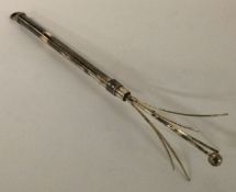 A Sterling silver swizzle stick.
