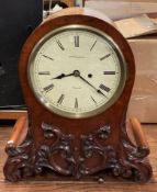 A good quality Victorian mahogany mantle clock with scroll decoration.