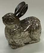 A silver snuff box in the form of a rabbit.