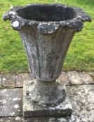 A good tapering fluted garden urn on square base.