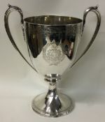 EDINBURGH: A good bright cut silver two handled trophy cup with crested decoration.