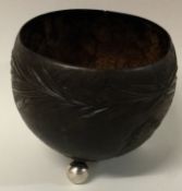 An early 18th Century silver mounted carved coconut cup.