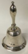 A Victorian silver table bell.