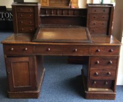 A Victorian mahogany twin pedestal desk with slope top.