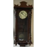 A large mahogany mounted wall clock.