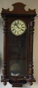 A large mahogany mounted wall clock.