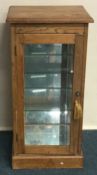 A small pine jeweller’s display case.