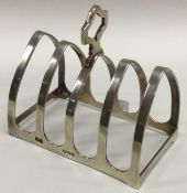 A small arched top silver toast rack. Birmingham.