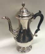 A heavy George III fluted silver coffee pot. London 1768. By LH.
