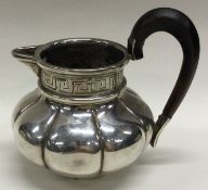 A Dutch silver cream jug. Marked to base.