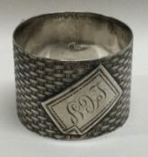 A novelty Russian silver napkin ring of basket weave design.