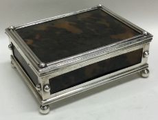 A French 19th Century silver and tortoiseshell hinged casket on feet.