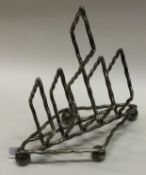A silver toast rack. Sheffield 1901. By James Dixon & Sons.