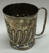 A Victorian silver chased christening mug. Birmingham 1898.