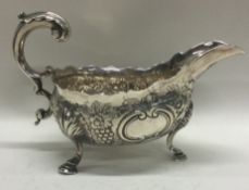 A heavy chased 18th Century silver sauce boat. London 1762.