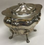 A heavy silver tea caddy with lift-off cover. Sheffield 1920. By Walker & Hall.