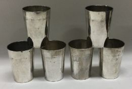 A set of six heavy Continental silver vodka cups.