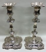 A pair of Edwardian style silver candlesticks with shell decoration. Sheffield 1961.