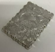 A Victorian silver card case engraved with a country scene. Birmingham 1848.