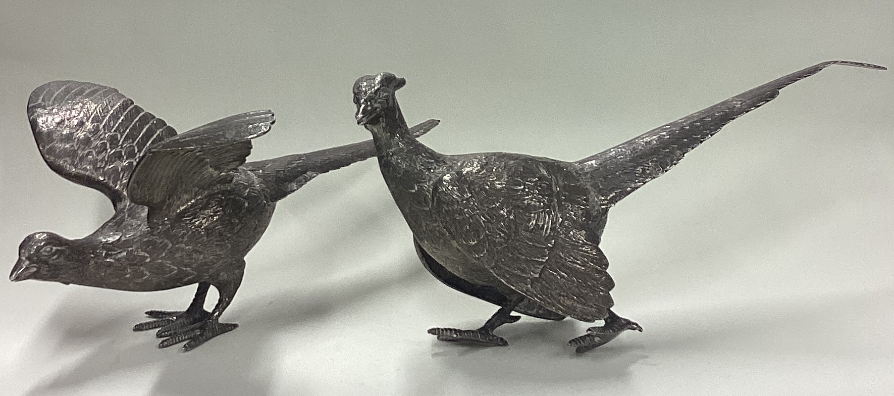 A large pair of textured silver pheasants. By Israel Freeman & Son.