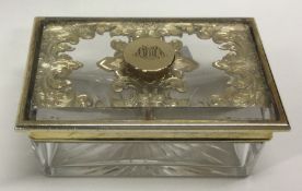 A rectangular silver gilt dressing table jar. London 1854. By John Harris.