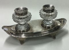A George III silver and glass inkstand on feet. London 1803. By John Emes.