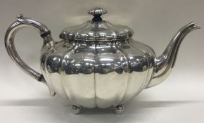 A fine Victorian silver teapot of pumpkin design. London 1845. By George Ivory.