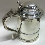 A good quality Queen Anne silver lidded tankard. London 1709. By Timothy Ley.