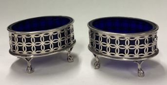 A pair of Georgian style Victorian silver and glass salts on ball feet.