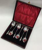 A cased Edwardian silver Chinoiserie spoon set. Birmingham 1903.
