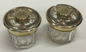 A pair of circular silver gilt dressing table jars. London 1854. By John Harris.