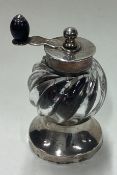 A Victorian silver and glass pepper grinder. Birmingham 1892. By Hukin & Heath.