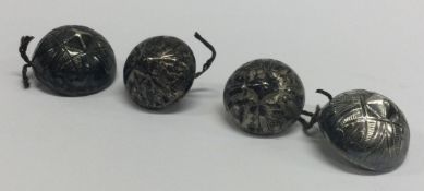 A set of five engraved silver buttons. Maker's mark only.