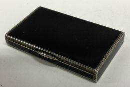 A silver and black enamelled cigarette case. Import marked.